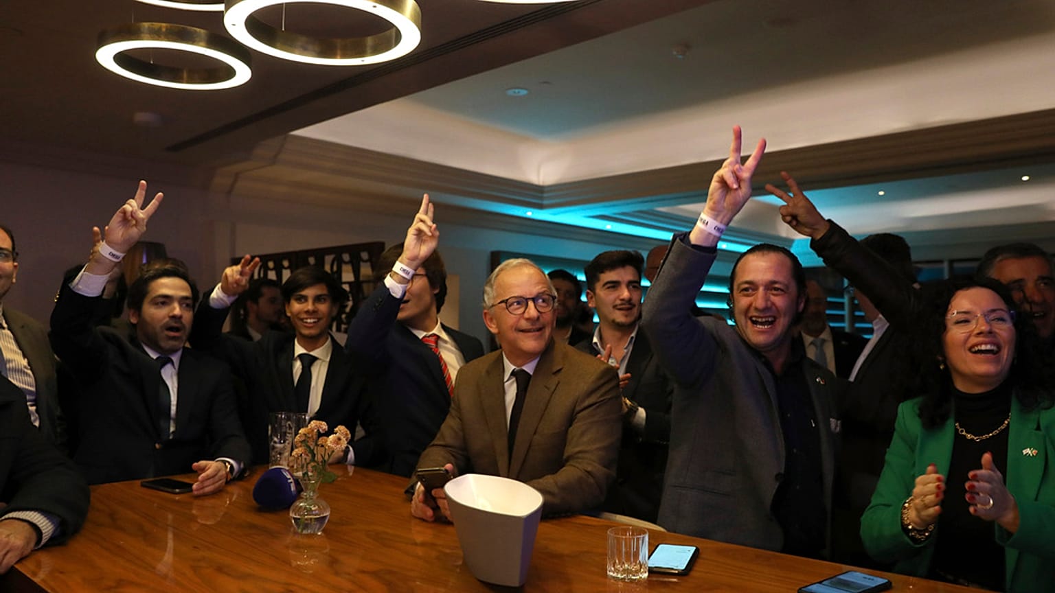 Populist right wing Chega supporters react during the announcement of the first electoral results at their party headquarter in Lisbon, Sunday, March 10, 2024.