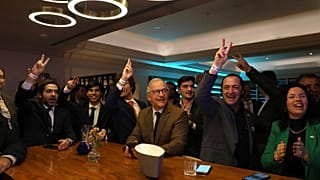 Populist right wing Chega supporters react during the announcement of the first electoral results at their party headquarter in Lisbon, Sunday, March 10, 2024.