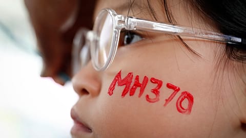 A girl has her face painted during a Day of Remembrance for MH370 event in Kuala Lumpur, Malaysia. 