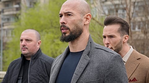 Andrew Tate, center, and his brother Tristan leave the tribunal in Bucharest in late February