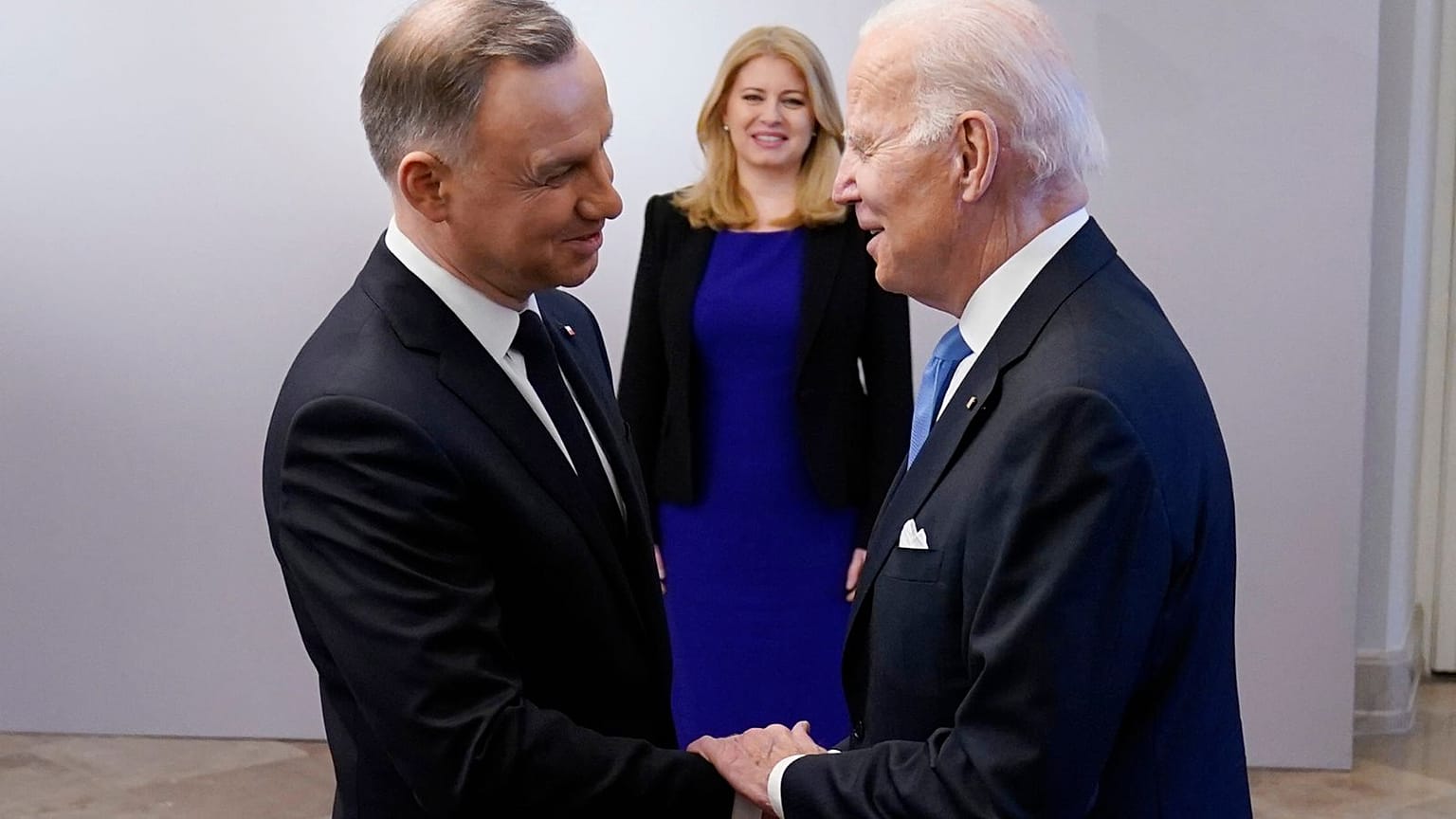 President Joe Biden, right, is greeted by Polish President Andrzej Duda, Feb. 22, 2023, at the Presidential Palace in Warsaw. 