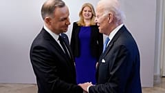 President Joe Biden, right, is greeted by Polish President Andrzej Duda, Feb. 22, 2023, at the Presidential Palace in Warsaw. 