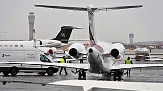 Planes are parked at a private jet terminal at Harry Reid International Airport ahead of the Super Bowl, 1 February 2024, in Las Vegas.