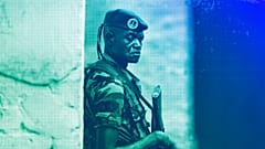 A soldier from the Central African Republic stands guard at a building used for joint meetings between them and US Army special forces, in Obo, April 2012