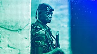 A soldier from the Central African Republic stands guard at a building used for joint meetings between them and US Army special forces, in Obo, April 2012