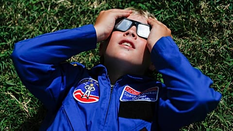 Tyler Hanson, of Fort Rucker, Ala., watches the sun moments before the total eclipse, Monday, Aug. 21, 2017, in Nashville, Tenn. 