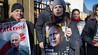 Protesters hold posters with portraits of detained opposition activists during a protest demanding freedom for political prisoners in Belarus, in front of the Belarus Embassy,