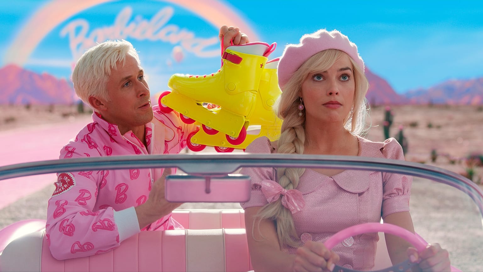This image released by Warner Bros. Pictures shows Ryan Gosling, left, and Margot Robbie in a scene from "Barbie."