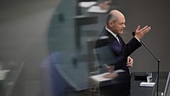 German Chancellor Olaf Scholz answers questions from lawmakers at the Bundestag in Berlin.