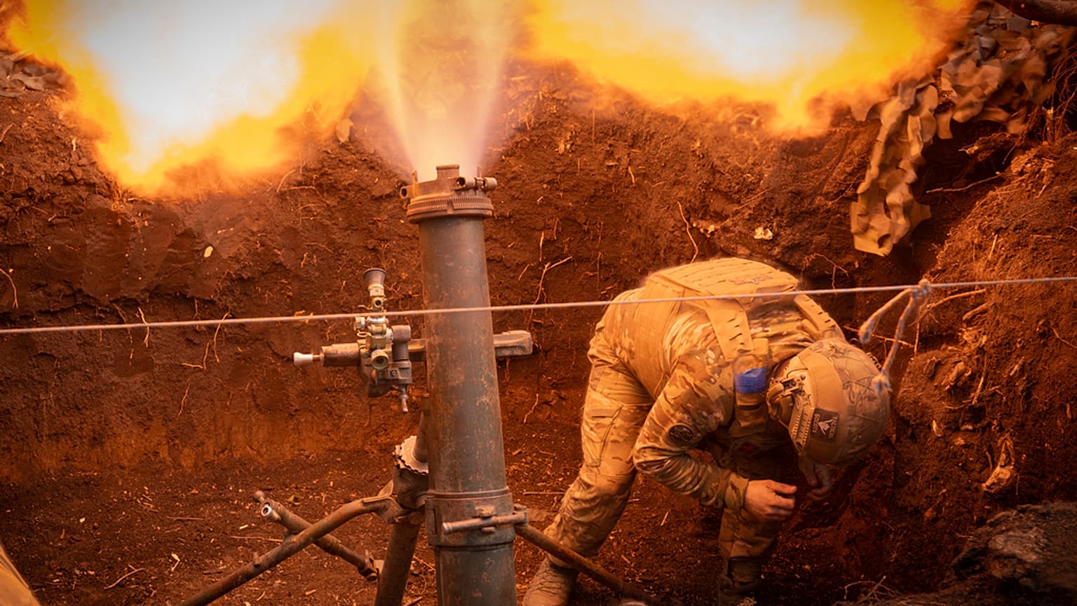 Ukrainian servicemen of the 28th Separate Mechanised Brigade fires a 122mm mortar towards Russian positions at the front line, near Bakhmut, Donetsk region, Ukraine, 3/3/24.