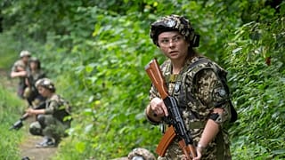 Volunteers practice during military training for civilians close to Kyiv, Ukraine,  11 August, 2023. 