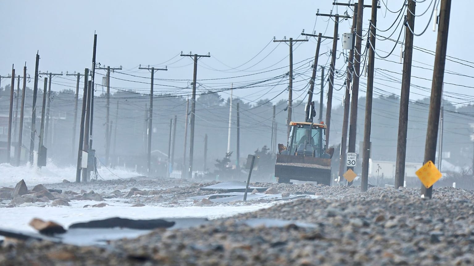 The remnants of East Beach Road are damaged after heavy overnight winds and surf battered the coastline, 10 January 2024 in Westport, Massachusetts.