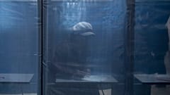 A woman fills in a ballot at a polling station during a presidential election in Russian-controlled Donetsk region of eastern Ukraine, Friday, March 15, 2024.
