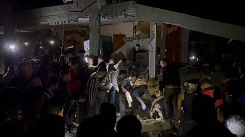 Palestinians search for survivors of Israeli strike