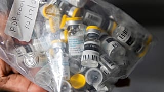 Vials of single doses of the Jynneos vaccine for monkeypox are seen from a cooler at a vaccinations site in 2022.