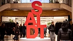 People walk around in a shop in the heart of Milan, Italy, during the January sales