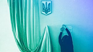 A volunteer makes preparations at a polling station ahead of Sunday's presidential election in Kyiv, March 2019