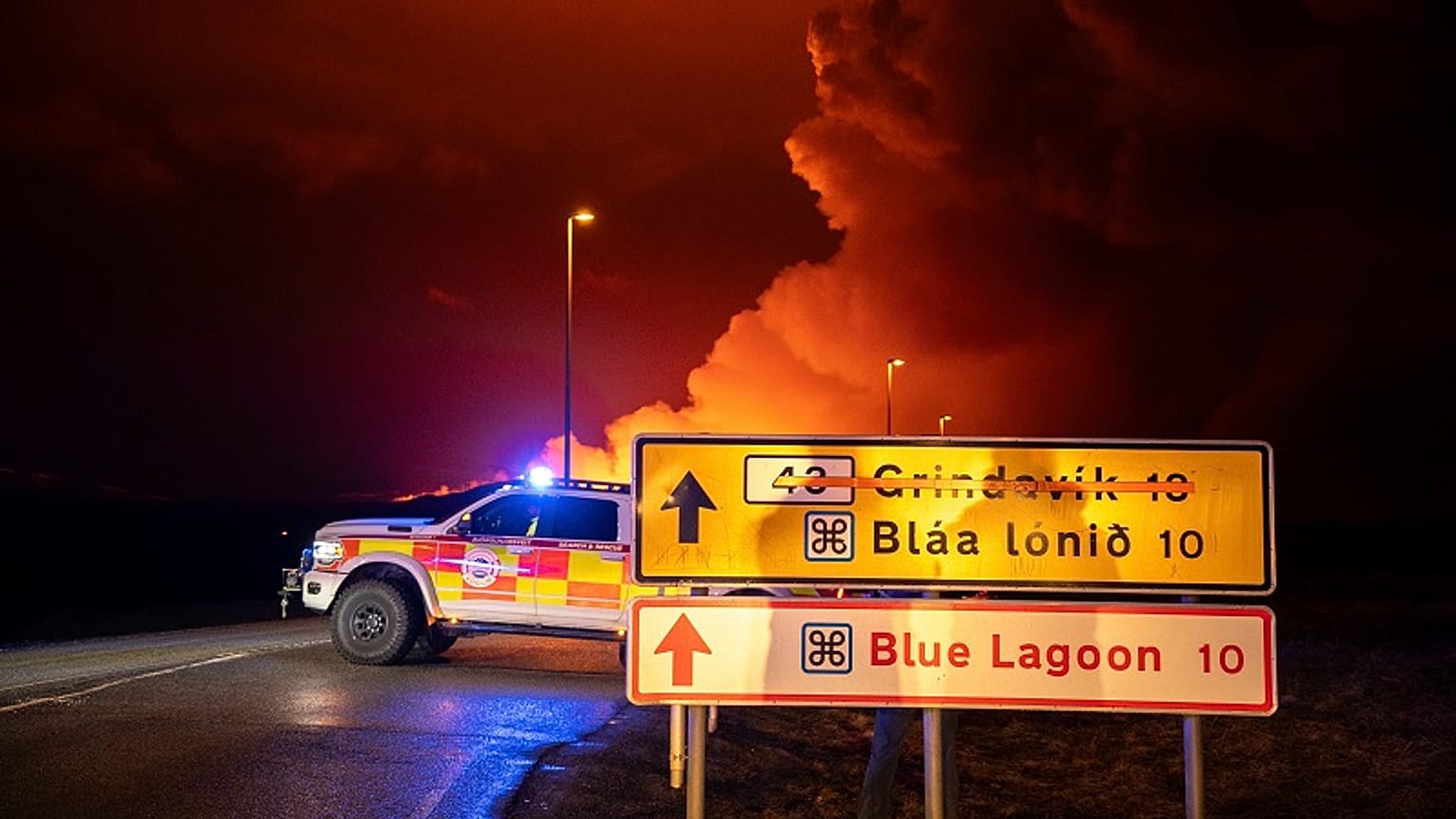 An emergency vehicle is stationed on a road leading to volcanic activity between Hagafell and Stóri-Skógfell, Iceland, on Saturday, March 16, 2024. 