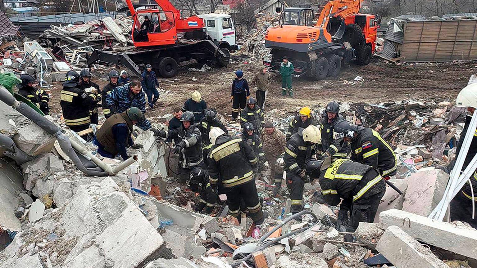 Photo released by Belgorod region governor Vyacheslav Gladkov's telegram channel on 18 March, 2024. Ministry employees working at destroyed building.