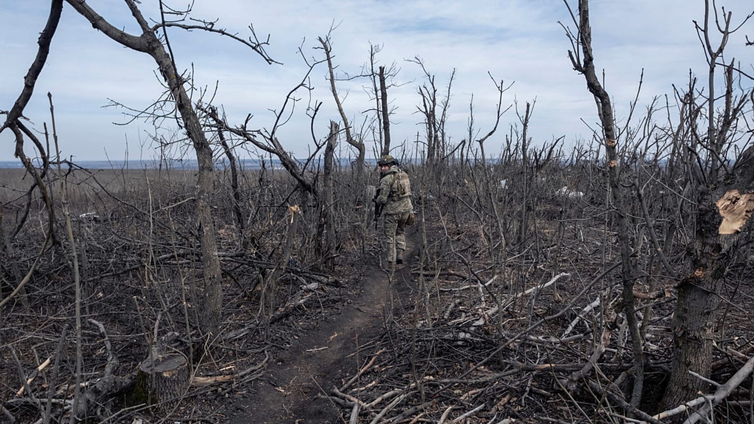 A Ukrainian soldier walks in position on the front-line near Klishchyivka, Donetsk region, Ukraine, Monday, March 18, 2024. 