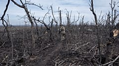 A Ukrainian soldier walks in position on the front-line near Klishchyivka, Donetsk region, Ukraine, Monday, March 18, 2024. 