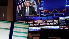 Fed Chairman Jerome Powell's news conference is displayed on a monitor on the floor at the New York Stock Exchange in New York, Wednesday, July 26, 2023.