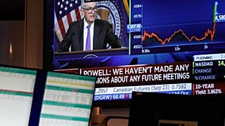 Fed Chairman Jerome Powell's news conference is displayed on a monitor on the floor at the New York Stock Exchange in New York, Wednesday, July 26, 2023.