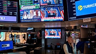 Traders work on the floor of the New York Stock Exchange Wednesday, March 20, 2024, during Powell speech