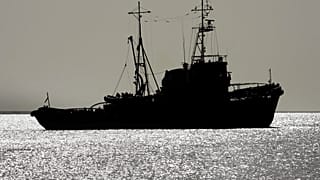 An Egyptian naval vessel used in the rescue sails back out to sea after briefly returning to the dock of Safaga harbour in Egypt Saturday, Feb. 4, 2006