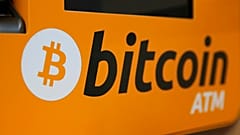 A Bitcoin logo is displayed on an ATM in Hong Kong, Thursday, Dec. 21, 2017.