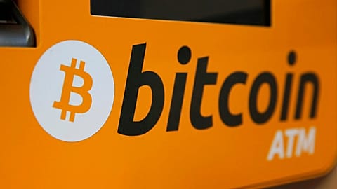 A Bitcoin logo is displayed on an ATM in Hong Kong, Thursday, Dec. 21, 2017.