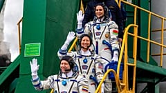 NASA astronaut Tracy Dyson, centre, Oleg Novitsky of Roscosmos, bottom, and Marina Vasilevskaya of Belarus