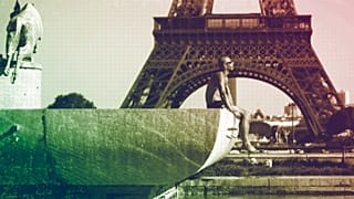 A man sunbaths at the Trocadero fountains in front of the Eiffel Tower, September 2023