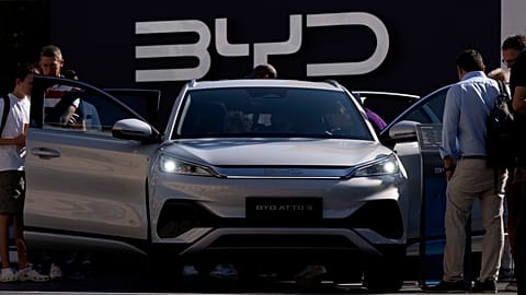 AP photo about visitors watch the BYD ATTO 3 at the IAA motor show in Munich, Germany, Friday, Sept. 8, 2023 