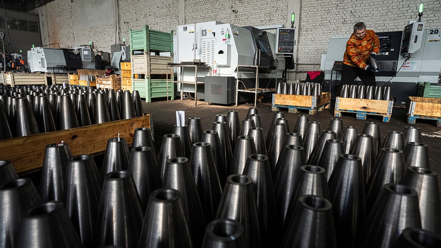 A worker stores mortar shells at a factory in Ukraine, on Wednesday, January 31, 2024.