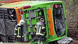 A coach lies overturned on its side at the scene of an accident on the A9, near Schkeuditz, Germany, Wednesday March 27. 2024.