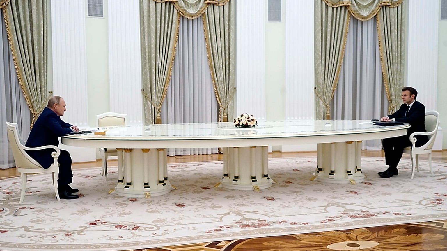 FILE - Russian President Vladimir Putin, left, listens to French President Emmanuel Macron during their meeting in the Kremlin in Moscow, Russia, Feb. 7, 2022.