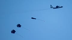 An aircraft airdrops humanitarian aid over northern Gaza Strip as seen from southern Israel, Thursday, March 28, 2024. 