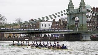 Oxford, right, and Cambridge pass under Hammersmith Bridgeduring the 168th Men's Boat Race 2023 on the River Thames, London, Sunday March 26, 2023.