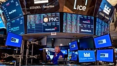 A trader working on the floor of the New York Stock Exchange 