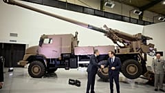 Antony Blinken and French Defence Minister, Sebastien Lecornu, shake hands as they visit arms manufacturer NEXTER that provides Caesar artillery to Ukraine in Versailles