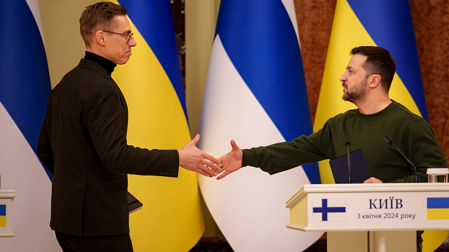 Finland's President Alexander Stubb, left, shakes hands with Ukraine's President Volodymyr Zelenskyy, after a press conference in Kyiv, Ukraine, Wednesday, April 3, 2024.