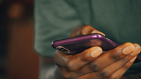 A person on a smartphone as a new app could be part of cognitive testing for dementia.