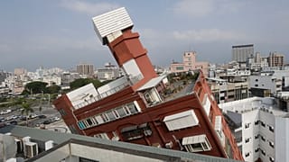 A partially collapsed building stands at a titled angle a day after a powerful earthquake struck in Hualien City, eastern Taiwan, Thursday, April 4, 2024.