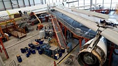Employees work on an aircraft at the Elbe Aircraft Factory during a visit of German chancellor Olaf Scholz in Dresden, Germany, Thursday, Feb. 29, 2024. 