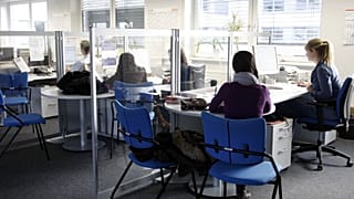 File photo of workers in an office in Berlin