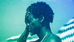 A man cools off in a shower at Ipanema beach, Rio de Janeiro, September 2023