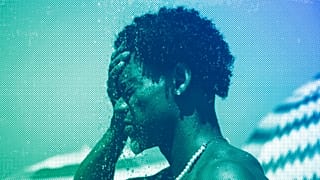 A man cools off in a shower at Ipanema beach, Rio de Janeiro, September 2023