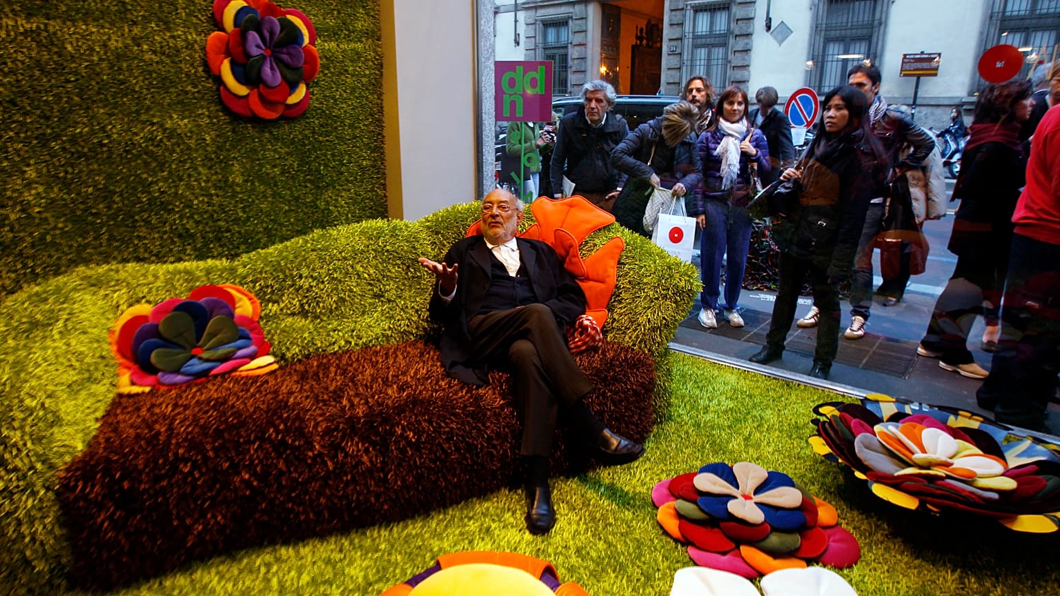 Gaetano Pesce sits among his creations at the Milan International Furniture Expo in 2010
