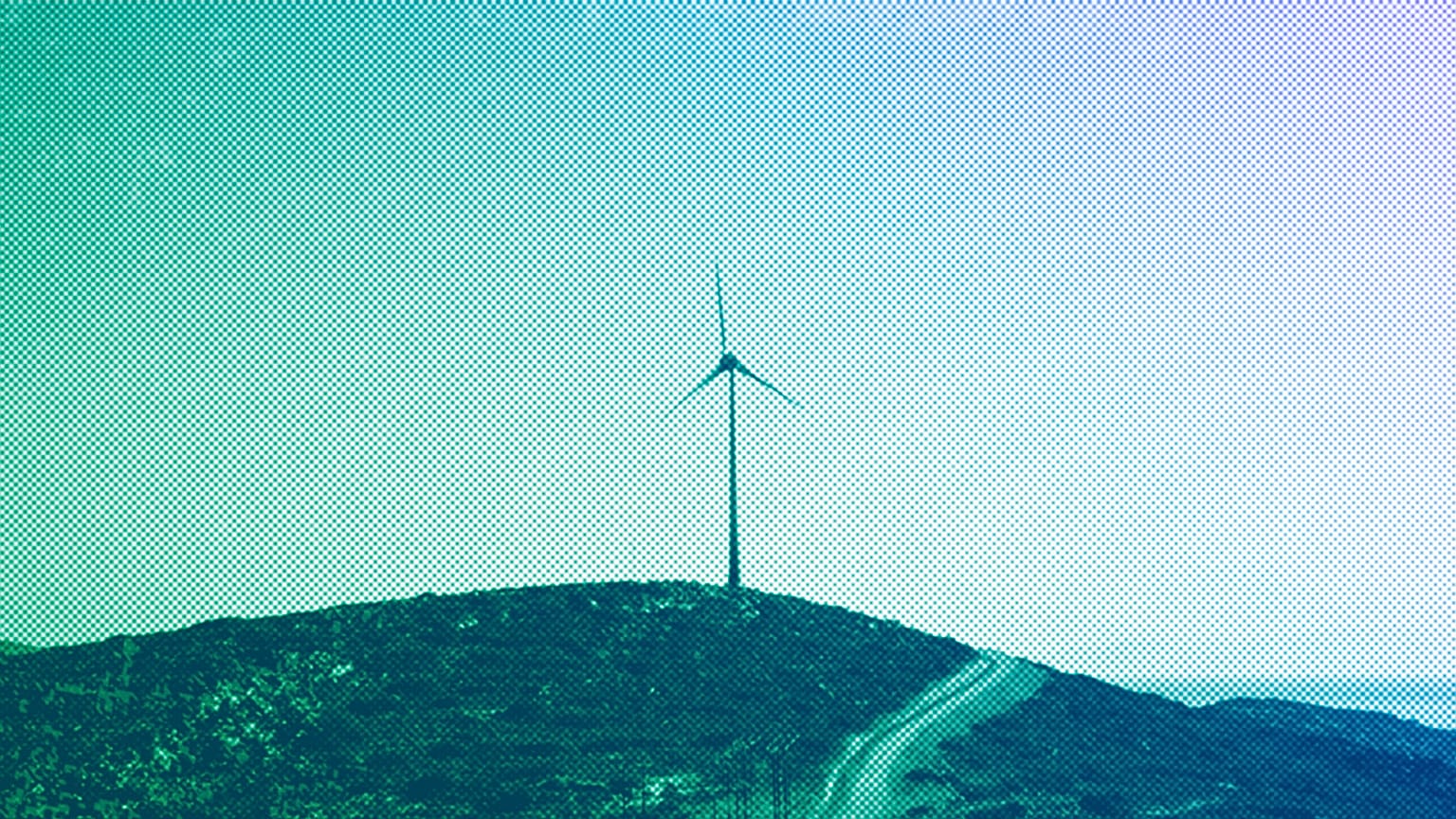 A road leads past a wind turbine stands on the Aegean island of Tilos, August 2018